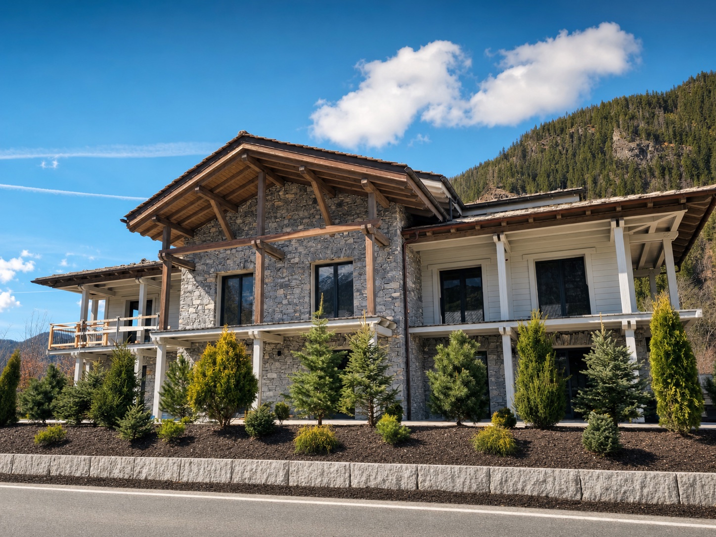 Façade en pierre et bois du chalet L’Ours Blanc